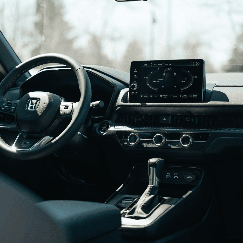 Driver hands on steering wheel inside a vehicle